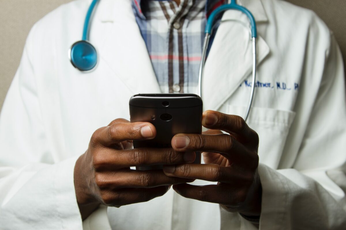 Doctor typing message to his client